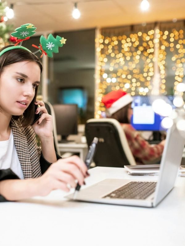 young-contemporary-businesswoman-with-mobile-phone-organizing-work-in-office.jpg